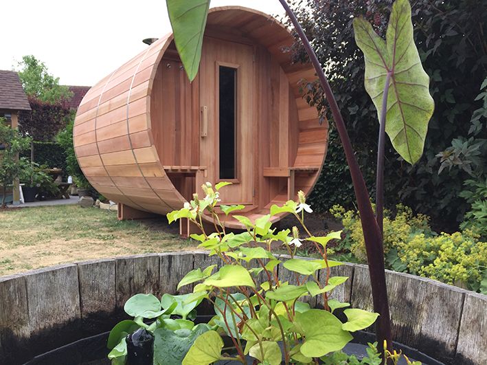 Sauna barrel in city garden.